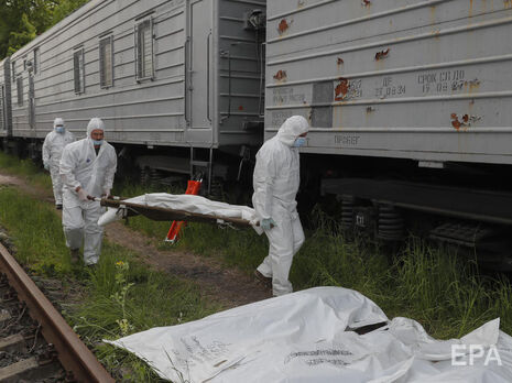 Сотни тел россиян, погибших в Украине, погрузили в вагоны-рефрижераторы. Фоторепортаж